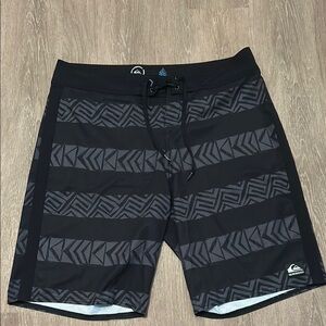 Quiksilver Black and Gray Board Shorts with Geometric Patterns
